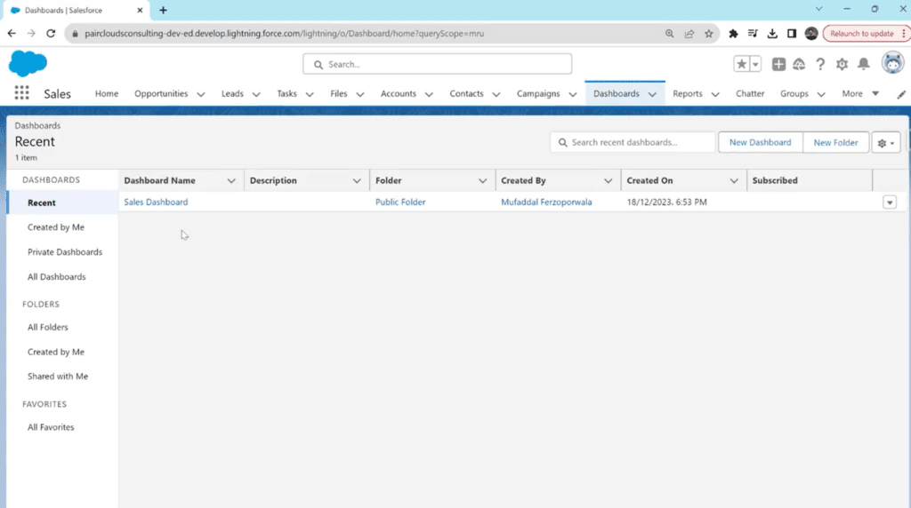 Accessing the Dashboards section via the top navigation bar in Salesforce.